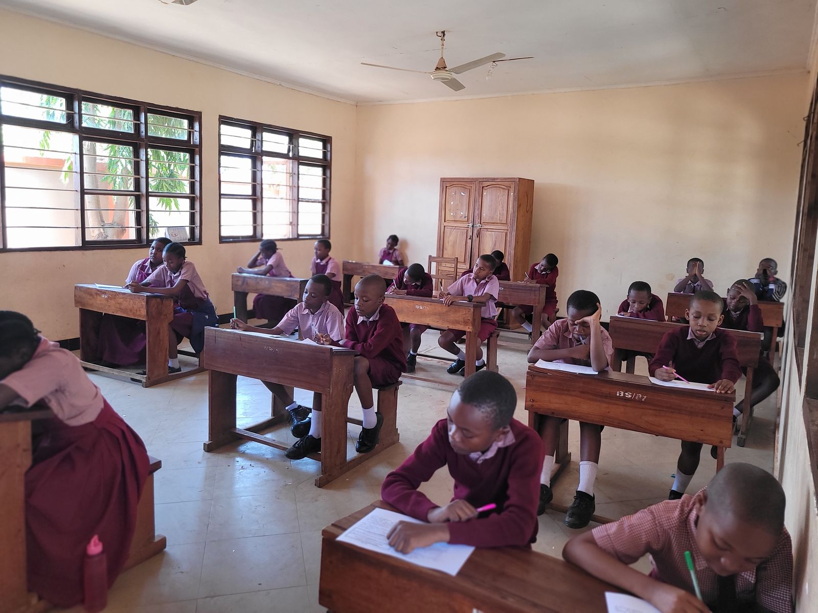 Older pupils writing at their desks